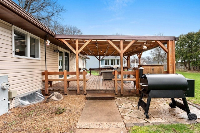 wooden terrace featuring fence