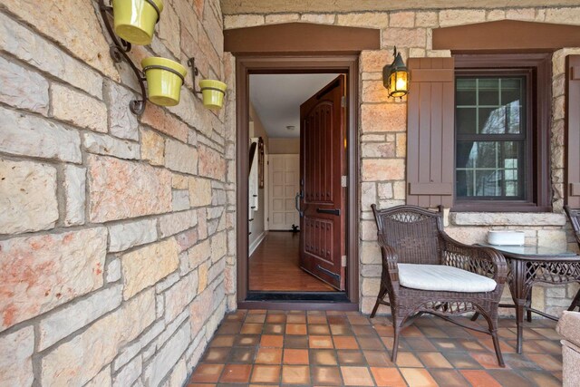 view of exterior entry with stone siding