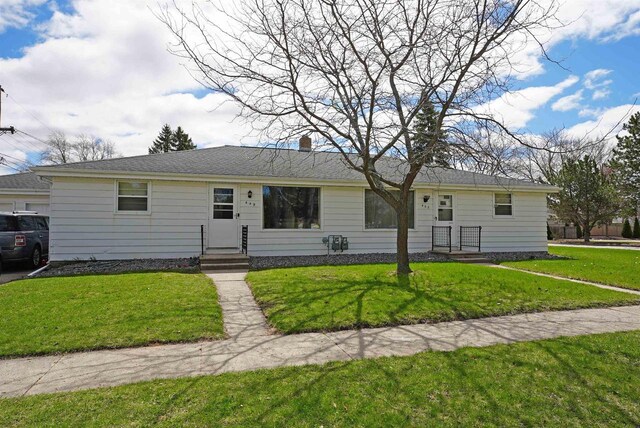 ranch-style house with a front yard