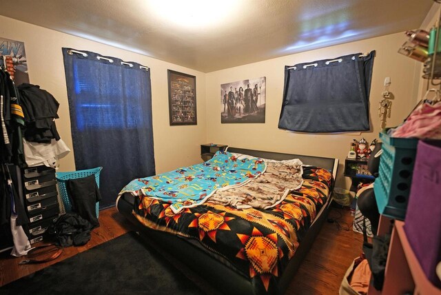 bedroom with wood finished floors