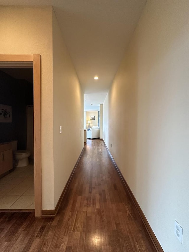 hall with recessed lighting, baseboards, and wood finished floors