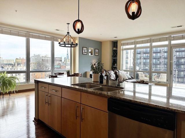 kitchen with a sink, visible vents, plenty of natural light, and dishwasher