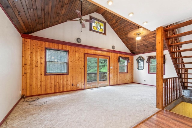 W7126 N Oakwood Cir, Neshkoro, WI 54960 - unfurnished living room with wood walls, a ceiling fan, and high vaulted ceiling