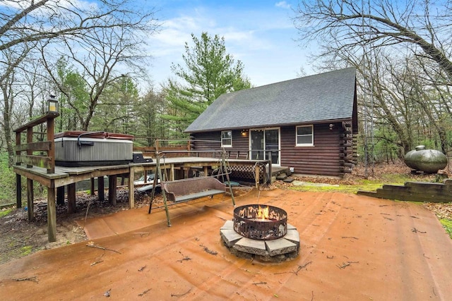 W7126 N Oakwood Cir, Neshkoro, WI 54960 - wooden deck with a hot tub, a patio, and a fire pit