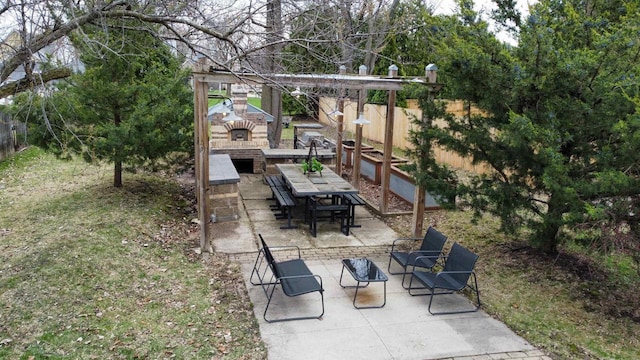 view of patio / terrace featuring fence and outdoor dining area
