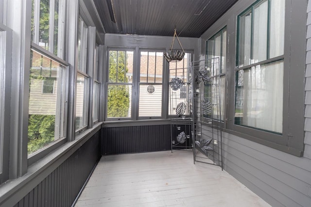 unfurnished sunroom featuring a wealth of natural light