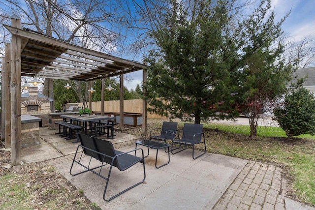 view of patio with an outdoor stone fireplace, outdoor dining area, and a pergola