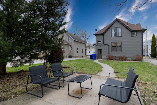 rear view of house with a patio and a yard