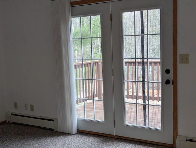 doorway to outside with carpet floors, a baseboard heating unit, and a healthy amount of sunlight