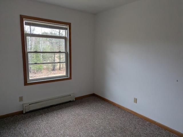 carpeted empty room with baseboards and a baseboard radiator
