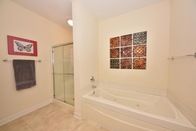 bathroom featuring a whirlpool tub, tile patterned floors, a shower stall, and baseboards