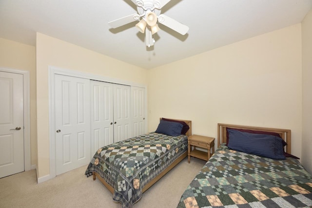 bedroom featuring carpet floors, a ceiling fan, and a closet