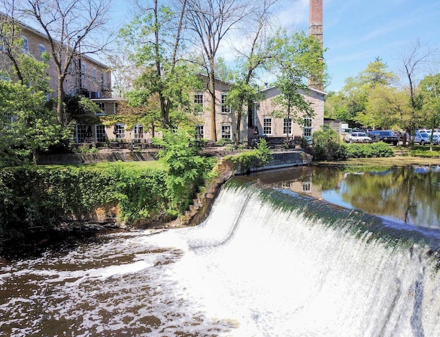 view of home's community with a water view