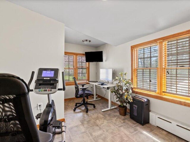 office featuring baseboards and a baseboard heating unit