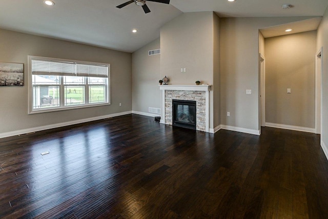unfurnished living room featuring a fireplace, a ceiling fan, recessed lighting, vaulted ceiling, and dark wood-style floors
