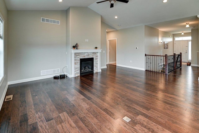 unfurnished living room featuring a ceiling fan, visible vents, and a fireplace