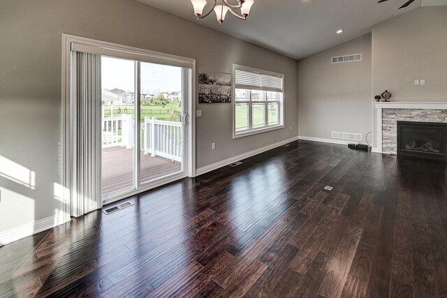 unfurnished living room with lofted ceiling, dark wood-style flooring, and visible vents