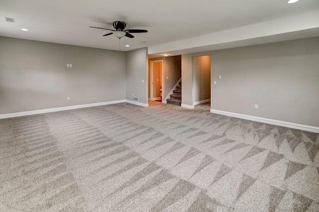 spare room with recessed lighting, baseboards, and carpet floors