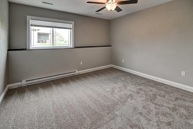 carpeted empty room with baseboards, a baseboard radiator, a ceiling fan, and visible vents