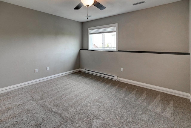 carpeted spare room with a ceiling fan, baseboards, visible vents, and baseboard heating