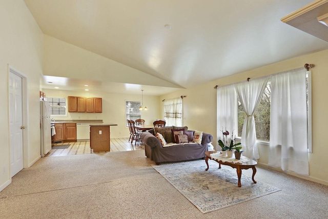 956 Williams St, Walworth, WI 53184 - living area featuring baseboards, light carpet, and vaulted ceiling