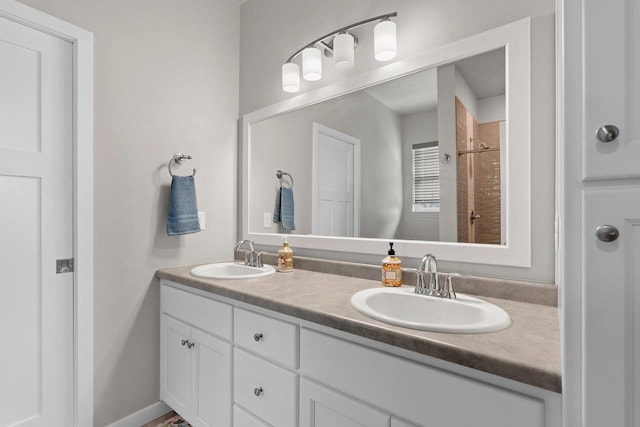 full bathroom with double vanity and a sink