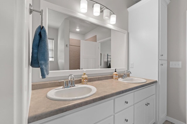 bathroom with double vanity and a sink