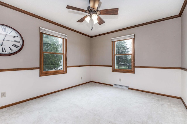 spare room featuring carpet floors, plenty of natural light, baseboards, and a baseboard heating unit