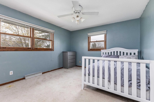 carpeted bedroom with baseboards, visible vents, and ceiling fan