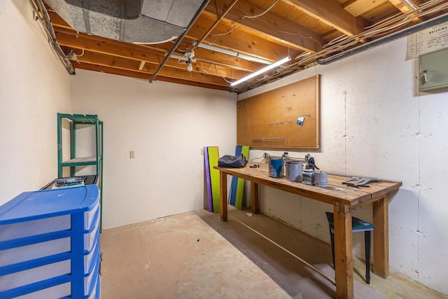 unfinished basement with a workshop area