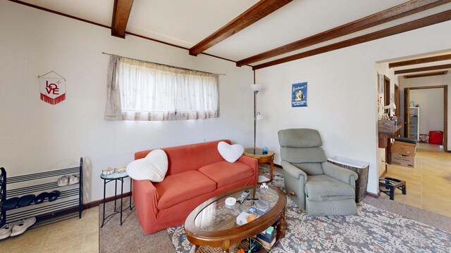 living room featuring baseboards and beam ceiling