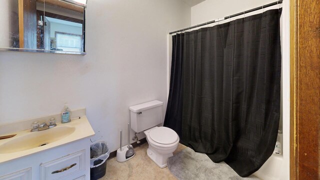 full bathroom featuring toilet and vanity