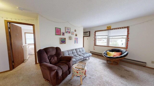 living room with a baseboard radiator, carpet, a baseboard heating unit, and a wall mounted air conditioner