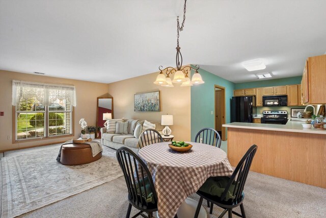dining space featuring an inviting chandelier, visible vents, and light colored carpet