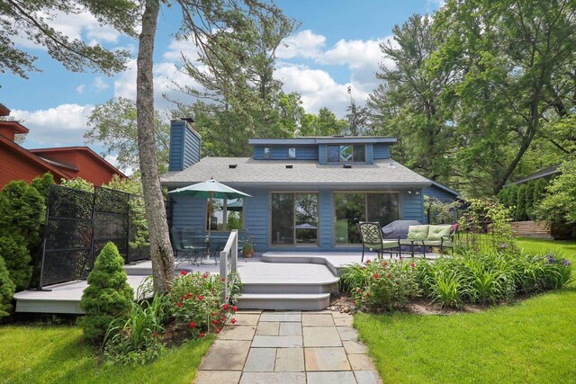W10134 Schiefelbein Rd, Poynette, WI 53955 - back of house featuring fence, a deck, a chimney, and outdoor lounge area