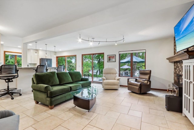 W10134 Schiefelbein Rd, Poynette, WI 53955 - living room featuring recessed lighting, baseboards, plenty of natural light, and light tile patterned floors
