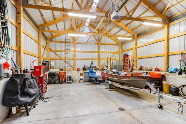 W10134 Schiefelbein Rd, Poynette, WI 53955 - garage with metal wall and a garage door opener