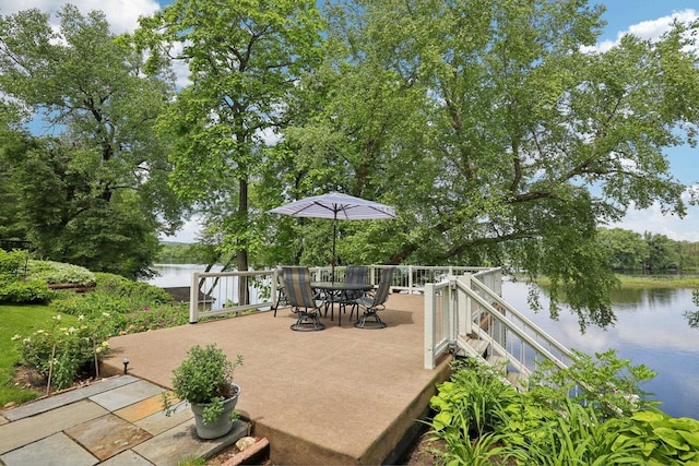 W10134 Schiefelbein Rd, Poynette, WI 53955 - view of patio / terrace with a water view and outdoor dining space