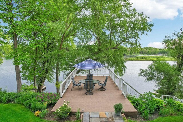 W10134 Schiefelbein Rd, Poynette, WI 53955 - view of patio / terrace featuring outdoor dining space and a water view