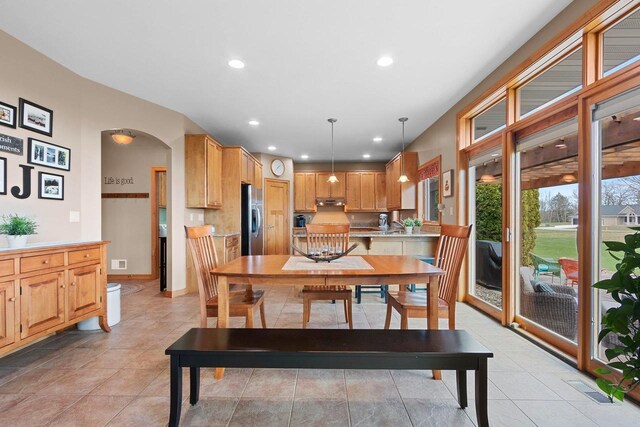 dining area with recessed lighting, arched walkways, light tile patterned floors, and visible vents