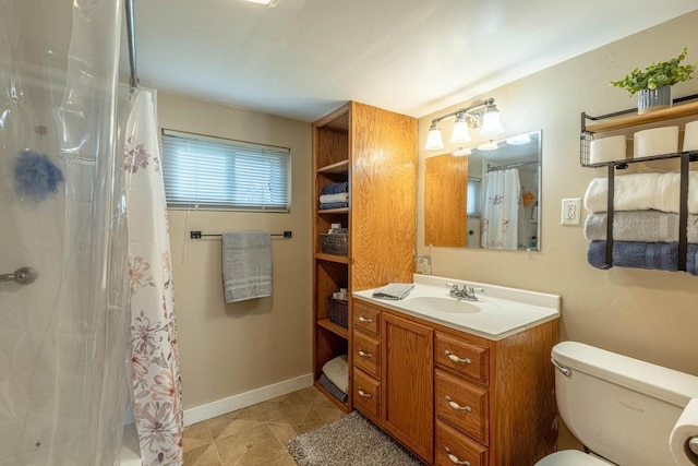 304 Mitchell St, Belleville, WI 53508 - bathroom with vanity, baseboards, curtained shower, and toilet