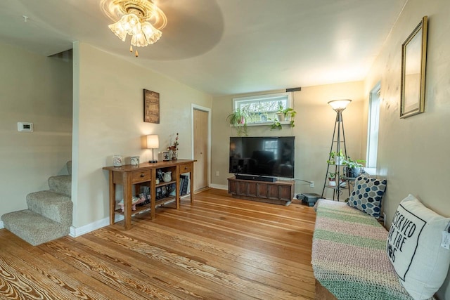 304 Mitchell St, Belleville, WI 53508 - living area featuring baseboards, stairway, and hardwood / wood-style floors