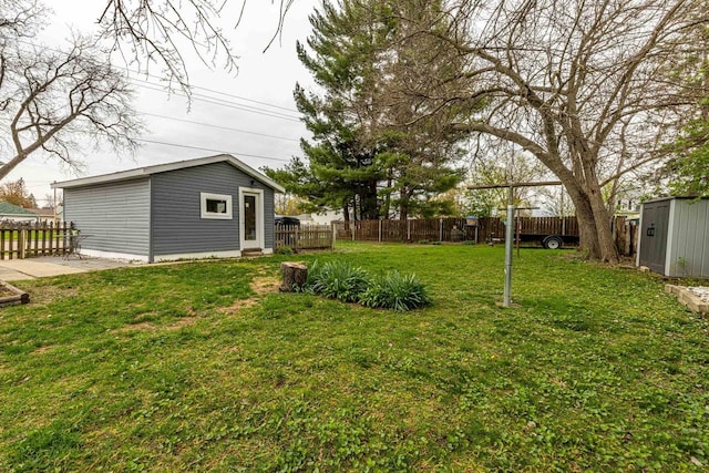 304 Mitchell St, Belleville, WI 53508 - view of yard featuring an outbuilding and a fenced backyard