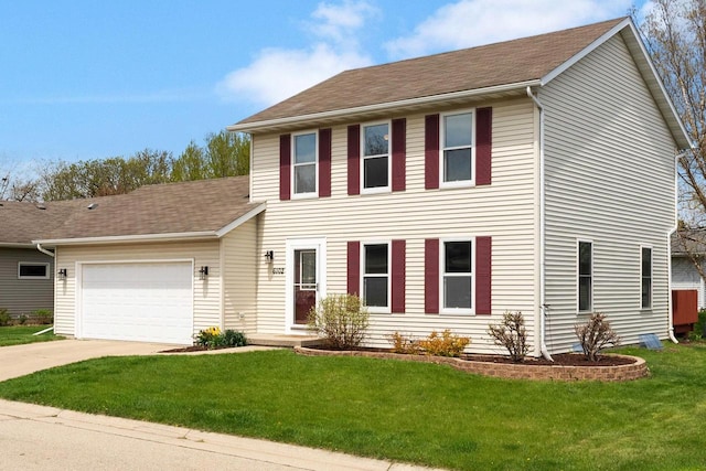 colonial inspired home with concrete driveway, a shingled roof, a front lawn, and a garage