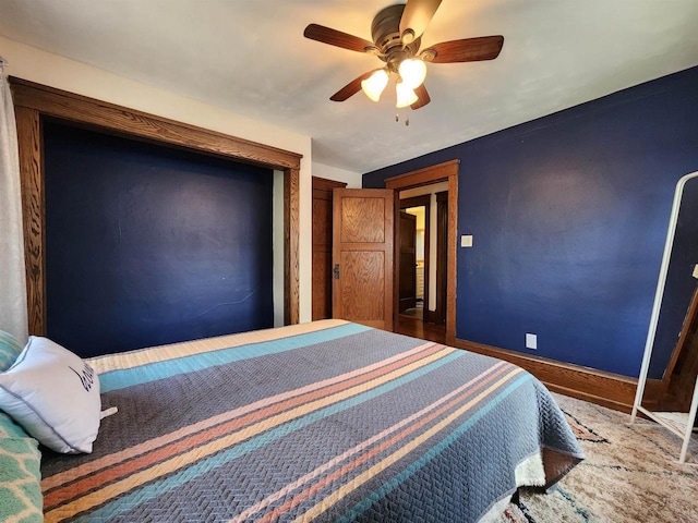 bedroom with baseboards and a ceiling fan