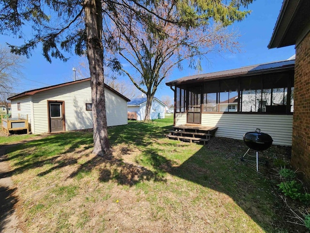 view of yard featuring a sunroom