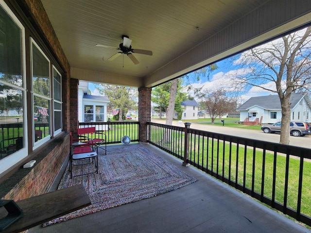 view of patio featuring a residential view and a ceiling fan