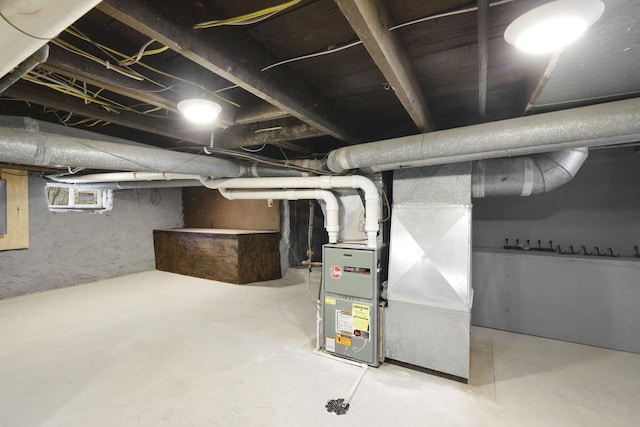 basement featuring heating unit and electric panel