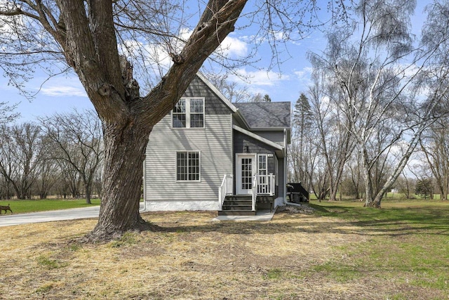 view of front of house with a front yard and entry steps