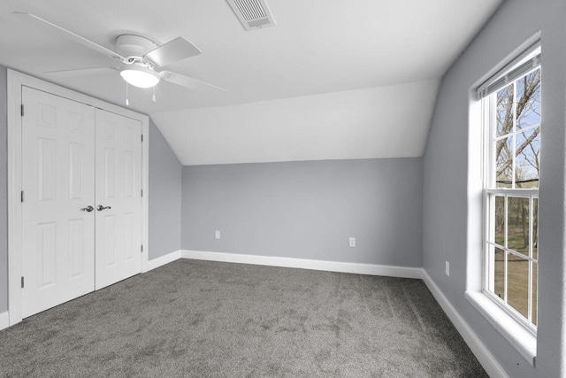 bonus room featuring baseboards, visible vents, carpet flooring, and lofted ceiling
